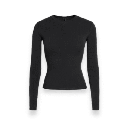 Front view of SKIMS long sleeve cotton jersey top showing soft stretch fabric and close-fit neckline in soot shade